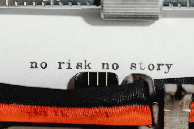 The words "no risk no story" typed on a typewriter, illustrating the importance of a Risk Breakdown Structure