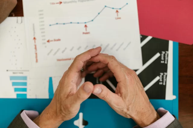 A professional reviewing NORSTRAT data charts and business analytics.