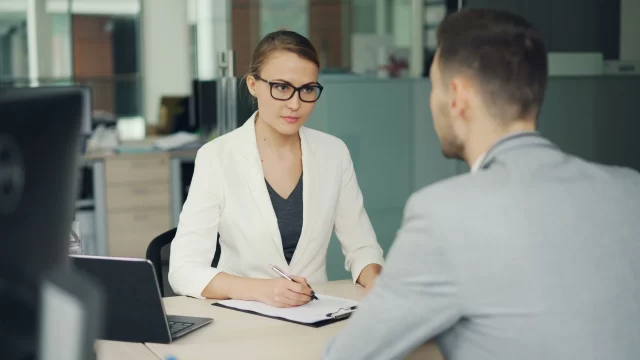 A professional job interview focusing on supply chain management in Switzerland.